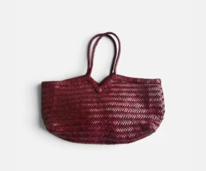 Burgundy handwoven leather tote bag with herringbone weave and long braided handles