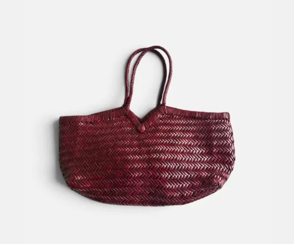 Burgundy handwoven leather tote bag with herringbone weave and long braided handles Burgundy handwoven leather tote bag with herringbone weave and long braided handles