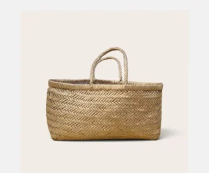This golden tan tote bag is woven by hand from real leather strips in a fine herringbone pattern. The weave is tight and even and the top edge is finished with a neat wrapped leather rim. Two round braided handles add a strong handmade look. The warm golden shade has a soft natural glow that looks rich in daylight. Every bag is made by skilled artisans in Kanpur India. Small differences in weave and shade are natural so no two pieces look exactly the same. The wide body gives plenty of room for your daily things. It can hold a water bottle and a book along with your wallet and phone and a small pouch. Golden tan pairs well with white and cream and olive and denim. It also brings a warm light touch to a simple outfit in any season. Leather gets softer and better looking with regular use. Keep it away from water and store it in a dust bag when not in use. *Where You Can Use It* Daily use College and office Shopping and market trips Weekend outings Beach and holiday travel Cafe and brunch Gifting for birthdays and weddings